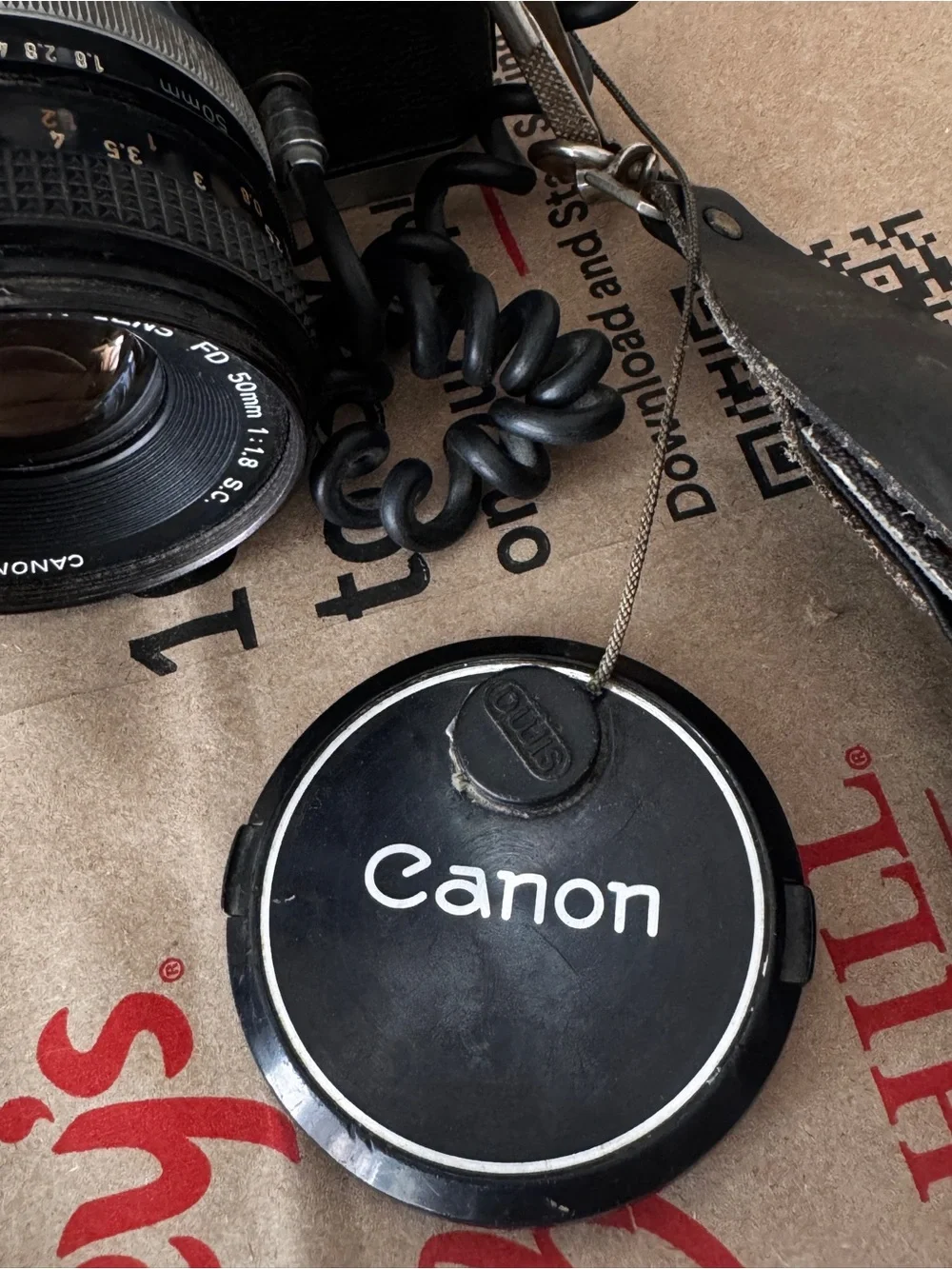 Canon Film Camera with Blue Flash Reflector and Patterned Orange-Accent Strap